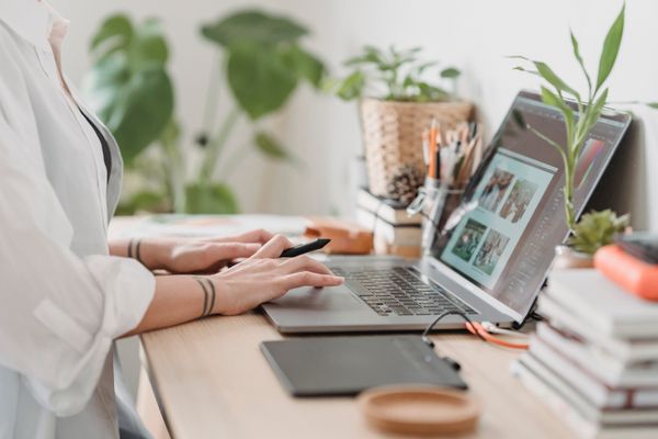 Remote team member handling Zoom live chat from a laptop